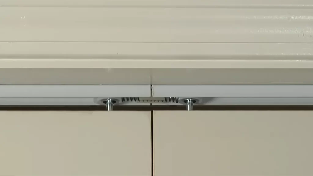 Attach the track to the top of the opening