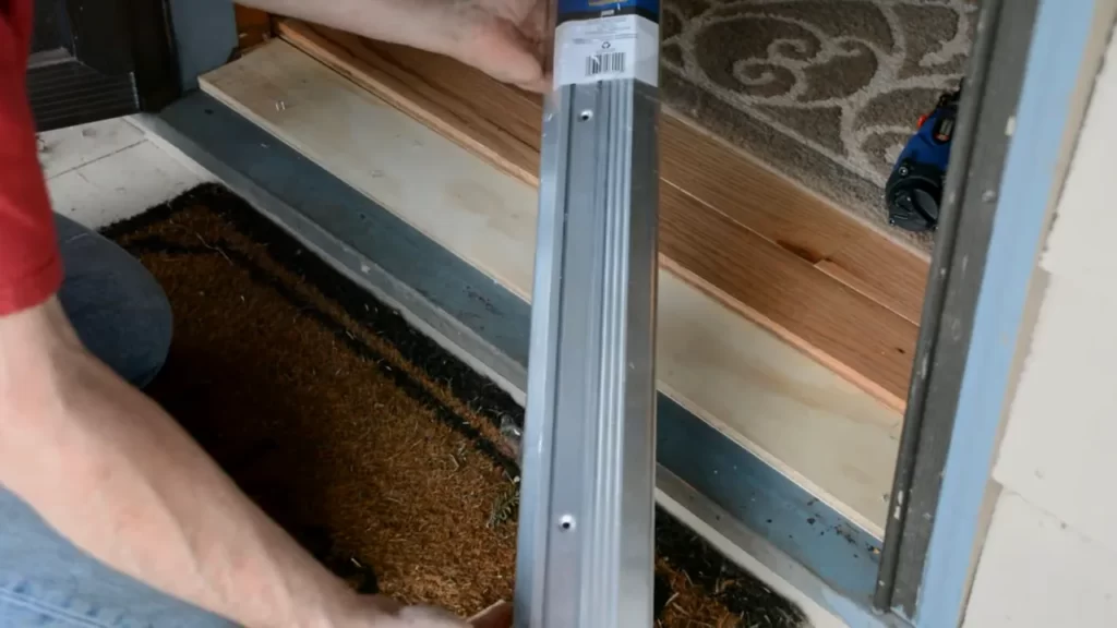 Use a saw to cut the threshold to size