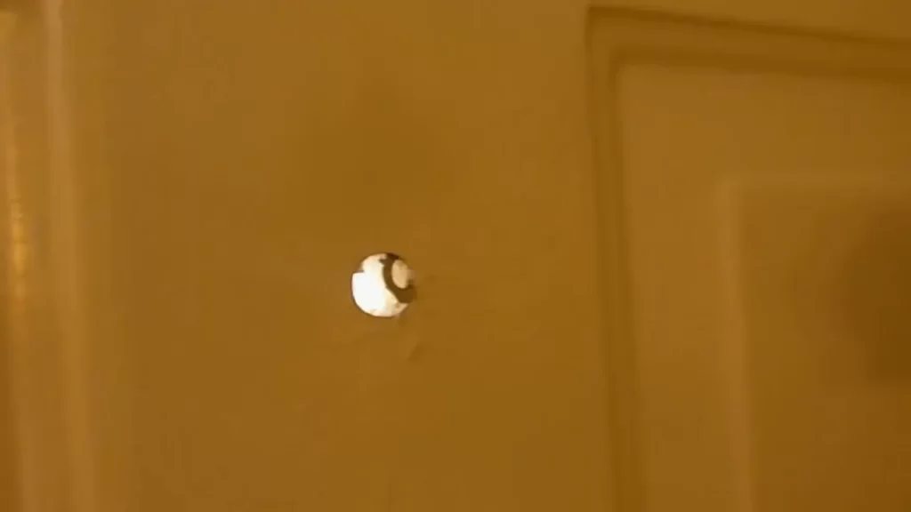 Measuring and marking the ideal location for the peephole