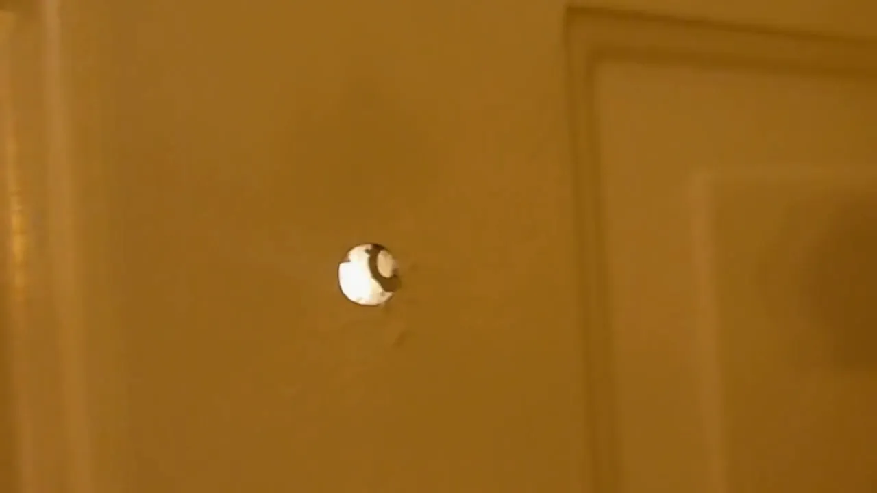 Measuring and marking the ideal location for the peephole