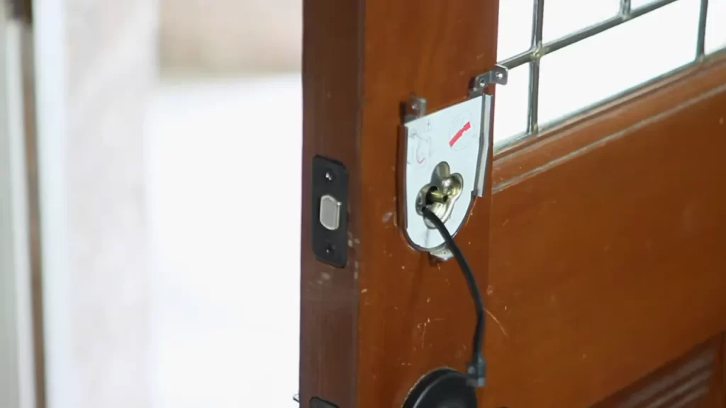 Assess the existing door and ensure it is compatible with a smart door lock