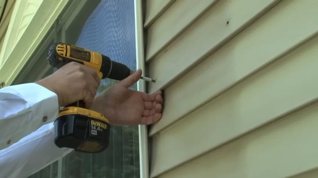Mark the placement for the top and bottom shutter hinges