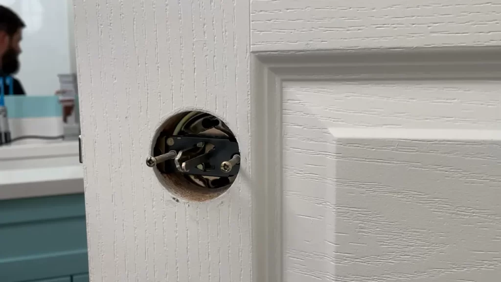 Measuring and marking the door for the lock